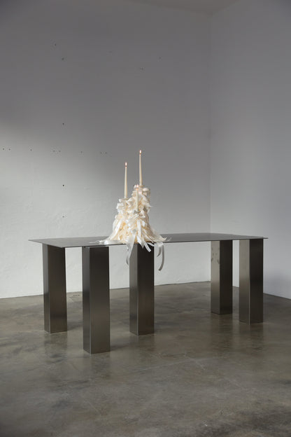 ATRIUM desk in brushed steel with bold rectangular legs, styled with white candles, by The Good Living & co
