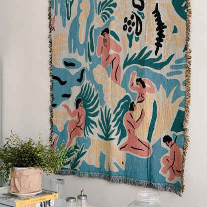 Kimbie woven throw blanket by Maitaimai displayed on the wall as textile art in a home interior