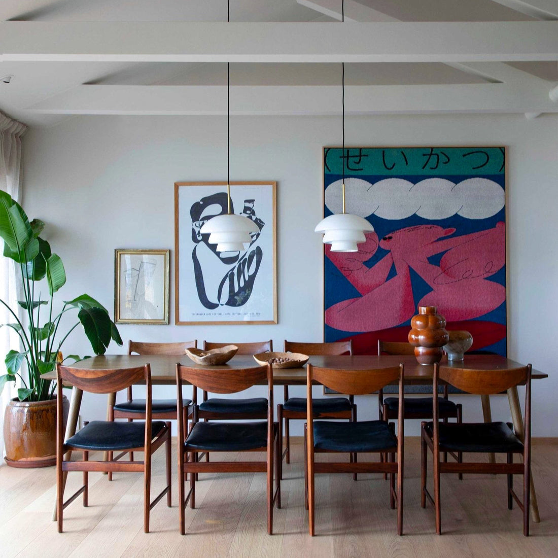 Suzukki woven throw blanket by Shun Sasaki displayed on the wall as textile art in a dining room interior