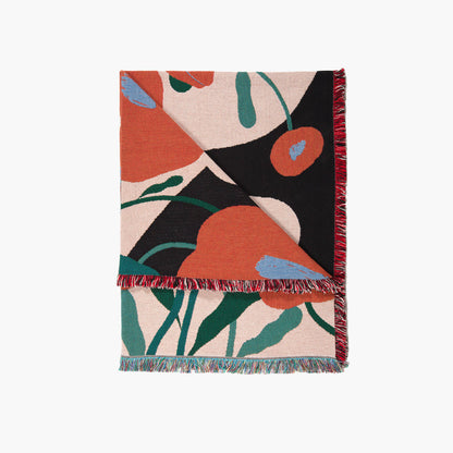 Detail of Melba woven throw blanket by Suvi Suitiala showing floral pattern and woven texture